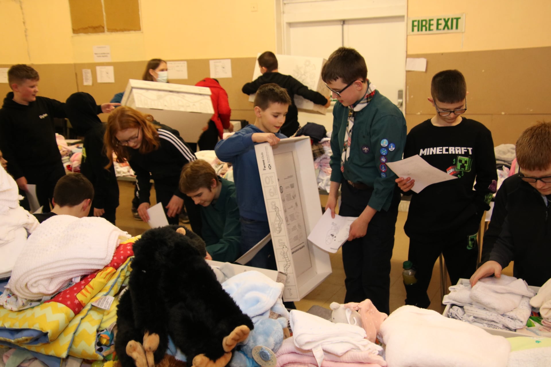 Scouts taking part in the Scotland Ukrainian Baby Box packing